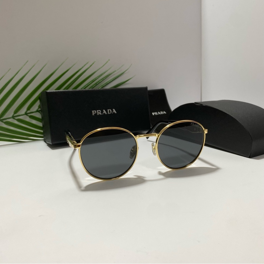 Prada Women's Sunglasses with Gold Frame and Black Lenses